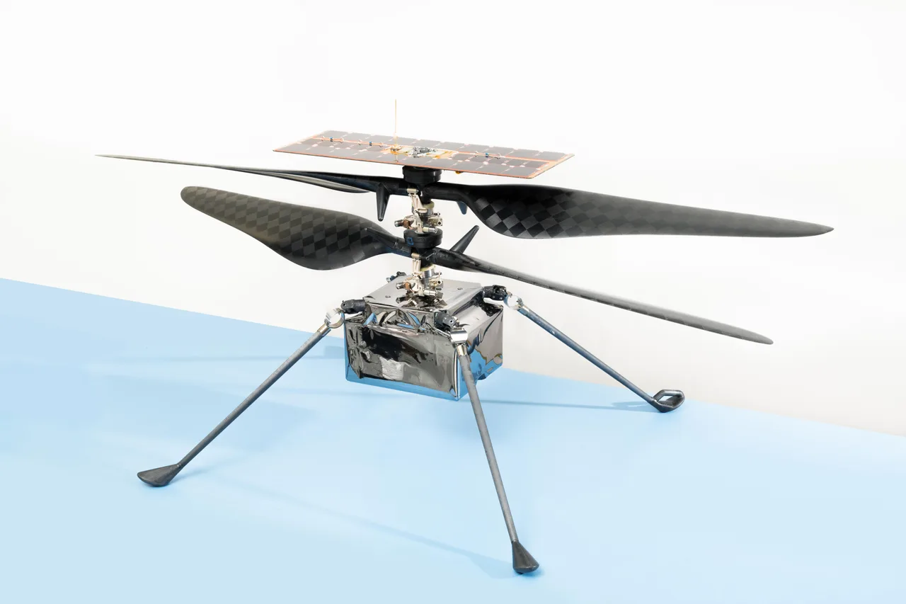 Ingenuity flight hardware showing the solar array, coaxial rotors, electronics body, and landing legs.