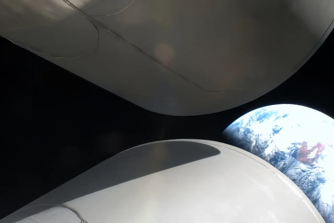 BE-3U engine nozzles on New Glenn’s second stage with the curved Earth beyond, photographed during NG-2.