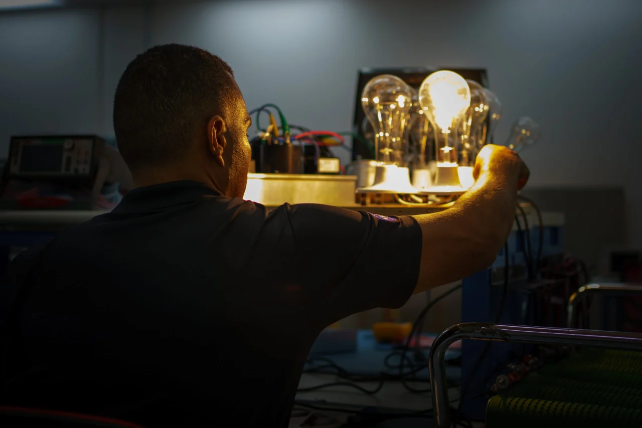 Loay Elbasyouni checking hardware at the laboratory bench.